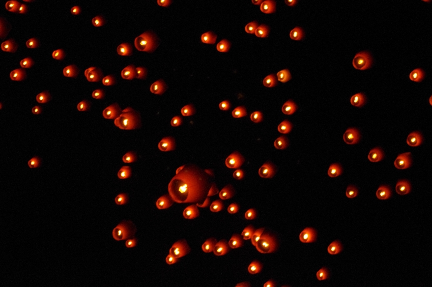 Lanterns rising and drifting away...
